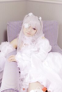 Rating: Safe Score: 0 Tags: 1girl dress frills kirakishou lips long_hair red_eyes sitting smile solo striped thighhighs vertical_stripes white_hair User: admin