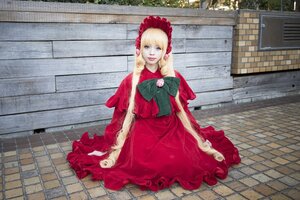 Rating: Safe Score: 0 Tags: 1girl blonde_hair blue_eyes bonnet bow brick_wall capelet dress fence flower looking_at_viewer on_floor pavement red_dress shinku sitting smile solo stone_floor tile_floor tiles wall User: admin