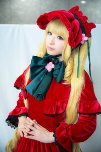 Rating: Safe Score: 0 Tags: 1girl blonde_hair blue_eyes bonnet bow dress drill_hair flower frills hands_together hat lips long_hair long_sleeves looking_at_viewer own_hands_together photo realistic red_dress rose shinku solo User: admin