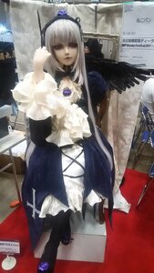 Rating: Safe Score: 0 Tags: 1girl bangs dress frills indoors long_hair long_sleeves looking_at_viewer photo red_eyes silver_hair sitting solo standing suigintou white_hair wings User: admin