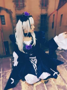 Rating: Safe Score: 0 Tags: 1girl blurry blurry_background depth_of_field dress flower hair_flower hair_ornament indoors long_hair long_sleeves photo purple_flower rose sitting solo suigintou white_hair User: admin