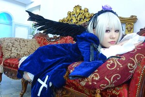 Rating: Safe Score: 0 Tags: 1girl couch dress feathers flower frills hairband indoors lips long_sleeves lying on_side on_stomach red_eyes solo suigintou white_hair wings User: admin