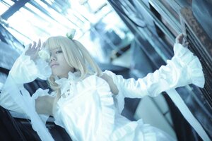 Rating: Safe Score: 0 Tags: 1girl bangs blonde_hair blue_eyes blurry blurry_background depth_of_field dress frills indoors kirakishou lips long_hair lying sitting solo white_dress User: admin