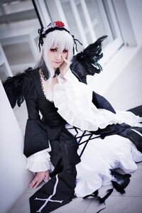 Rating: Safe Score: 0 Tags: 1girl black_dress dress feathers flower frills gothic_lolita hairband indoors lolita_fashion long_hair long_sleeves looking_at_viewer silver_hair sitting solo suigintou User: admin