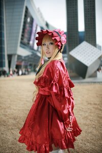 Rating: Safe Score: 0 Tags: 1girl blonde_hair blue_eyes blurry blurry_background bonnet building depth_of_field dress frills long_hair looking_at_viewer outdoors photo photo_background red_dress shinku solo User: admin