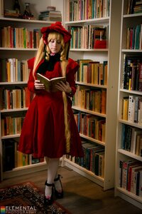 Rating: Safe Score: 0 Tags: 1girl blonde_hair book book_stack bookshelf dress hat library long_hair red_dress shinku solo standing User: admin