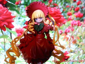 Rating: Safe Score: 0 Tags: 1girl blonde_hair blue_eyes blurry bonnet bow bowtie depth_of_field doll dress flower frills green_bow long_hair long_sleeves looking_at_viewer red_dress shinku sidelocks solo standing twintails very_long_hair User: admin