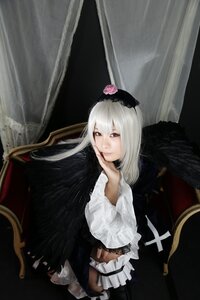 Rating: Safe Score: 0 Tags: 1girl bangs black_wings chair curtains dress flower frills gothic_lolita lolita_fashion long_hair long_sleeves looking_at_viewer red_eyes sitting solo suigintou wings User: admin