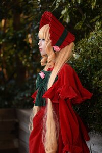 Rating: Safe Score: 0 Tags: 1girl blonde_hair blue_eyes blurry bonnet bow dress drill_hair lips lipstick long_hair outdoors profile red_dress shinku solo standing User: admin