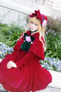 Rating: Safe Score: 0 Tags: 1girl blonde_hair blue_eyes blurry bow depth_of_field dress flower long_hair long_sleeves looking_at_viewer red_capelet red_dress shinku solo User: admin