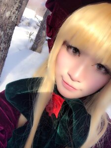 Rating: Safe Score: 0 Tags: 1girl bangs blonde_hair blurry building close-up closed_mouth coat depth_of_field gloves hat lips looking_at_viewer realistic scarf shinku smile solo User: admin