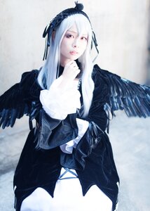 Rating: Safe Score: 0 Tags: 1girl black_dress black_wings blurry blurry_background depth_of_field dress hairband long_hair long_sleeves looking_at_viewer red_eyes silver_hair solo suigintou wings User: admin