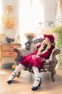 Rating: Safe Score: 0 Tags: 1girl blue_eyes chair dress flower long_hair shinku shoes sitting solo User: admin