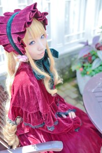 Rating: Safe Score: 0 Tags: 1girl blonde_hair blue_eyes blurry blurry_background bonnet bow capelet closed_mouth depth_of_field dress drill_hair flower frills lolita_fashion long_hair long_sleeves looking_at_viewer red_dress shinku smile solo User: admin