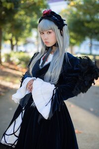 Rating: Safe Score: 0 Tags: 1girl bangs blurry blurry_background brown_eyes closed_mouth depth_of_field fur_trim lips long_hair long_sleeves looking_at_viewer outdoors solo standing suigintou User: admin