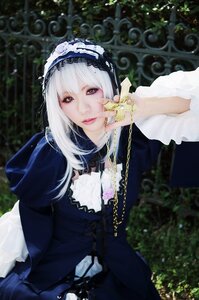 Rating: Safe Score: 0 Tags: 1girl chain dress frills gothic_lolita hairband lips lolita_fashion long_hair long_sleeves looking_at_viewer purple_eyes sitting solo suigintou white_hair User: admin
