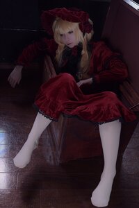 Rating: Safe Score: 0 Tags: 1girl blonde_hair blue_eyes bonnet dress flower long_hair long_sleeves red_dress red_flower red_rose rose shinku sitting solo User: admin