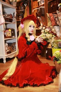 Rating: Safe Score: 0 Tags: 1girl blonde_hair bonnet dress flower long_hair looking_at_viewer photo red_dress rose shinku sitting solo User: admin