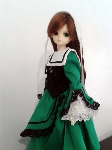 Rating: Safe Score: 0 Tags: 1girl brown_hair doll dress frills green_dress green_eyes long_hair long_sleeves looking_at_viewer simple_background solo standing suiseiseki User: admin