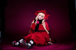 Rating: Safe Score: 0 Tags: 1girl blonde_hair blue_eyes bow capelet dress flower lips long_hair looking_at_viewer red_dress ribbon rose shinku shoes sitting solo User: admin