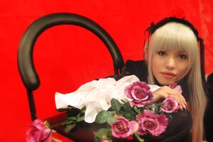 Rating: Safe Score: 0 Tags: 1girl blonde_hair flower gothic_lolita hairband lips lolita_fashion long_hair looking_at_viewer pink_rose realistic red_background red_rose rose shinku solo suigintou User: admin