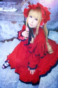 Rating: Safe Score: 0 Tags: 1girl blonde_hair blue_eyes blurry blurry_background blurry_foreground bonnet bow depth_of_field dress flower frills long_hair long_sleeves looking_at_viewer photo red_dress rose shinku shoes sitting solo User: admin