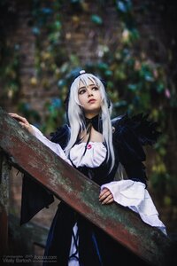 Rating: Safe Score: 0 Tags: 1girl blue_eyes blurry blurry_background breasts cleavage depth_of_field dress lips long_hair sitting solo suigintou User: admin