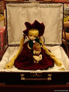 Rating: Safe Score: 0 Tags: 1girl blonde_hair bonnet doll dress indoors long_sleeves painting_(object) shinku solo stuffed_animal User: admin