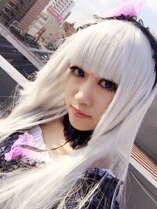 Rating: Safe Score: 0 Tags: 1girl bangs building city closed_mouth eyelashes lace lips long_hair looking_at_viewer purple_eyes solo suigintou white_hair User: admin