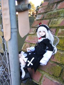 Rating: Safe Score: 0 Tags: 1girl black_dress black_footwear boots closed_eyes doll dress flower hairband long_hair outdoors rose sitting solo suigintou white_hair User: admin