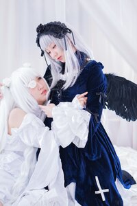 Rating: Safe Score: 0 Tags: 2girls angel_wings bangs black_dress black_wings closed_eyes dress feathered_wings feathers hairband lips lolita_fashion long_hair long_sleeves multiple_cosplay multiple_girls siblings sisters sitting suigintou tagme white_hair wings User: admin