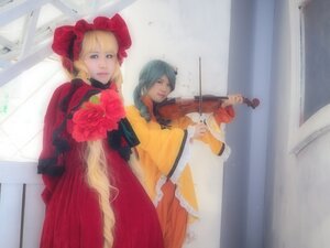 Rating: Safe Score: 0 Tags: 2girls blonde_hair blue_eyes blue_hair bow curtains dress flower frills instrument lips long_hair multiple_cosplay multiple_girls realistic red_dress rose shinku tagme violin User: admin