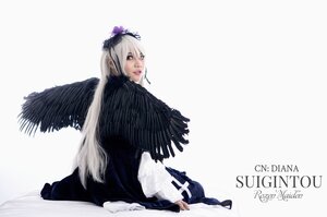 Rating: Safe Score: 0 Tags: 1girl black_wings dress feathers lips long_hair long_sleeves looking_back silver_hair sitting solo striped suigintou wings User: admin