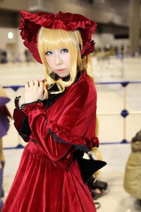 Rating: Safe Score: 0 Tags: 1girl blonde_hair blue_eyes blurry blurry_background blurry_foreground bonnet capelet depth_of_field dress flower long_hair long_sleeves looking_at_viewer motion_blur outdoors photo photo_background red_capelet red_dress shinku solo User: admin