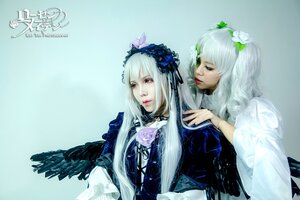 Rating: Safe Score: 0 Tags: 2girls black_wings flower hair_ornament lips long_hair multiple_cosplay multiple_girls realistic red_eyes ribbon sisters suigintou tagme wings User: admin