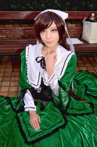 Rating: Safe Score: 0 Tags: 1girl brown_hair closed_mouth dress frills green_dress green_eyes heterochromia long_sleeves looking_at_viewer red_eyes sitting smile solo suiseiseki User: admin