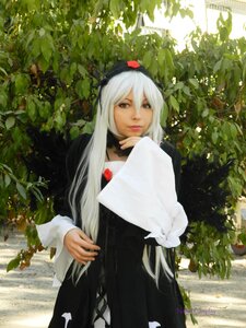 Rating: Safe Score: 0 Tags: 1girl black_dress dress hair_between_eyes holding lips long_hair long_sleeves outdoors solo suigintou tree white_hair User: admin