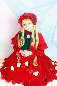 Rating: Safe Score: 0 Tags: 1girl blonde_hair blue_eyes bonnet dress drill_hair flower long_hair long_sleeves looking_at_viewer red_dress red_flower red_rose rose shinku solo User: admin