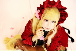 Rating: Safe Score: 0 Tags: 1girl bangs blonde_hair blue_eyes blurry bonnet bow depth_of_field dress flower lips long_hair long_sleeves looking_at_viewer lying on_stomach photo red_dress shinku solo User: admin