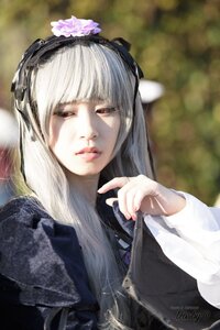 Rating: Safe Score: 0 Tags: 1girl bangs blunt_bangs blurry blurry_background closed_mouth depth_of_field dress flower hair_ornament lips long_hair long_sleeves looking_at_viewer red_eyes signature solo suigintou upper_body User: admin