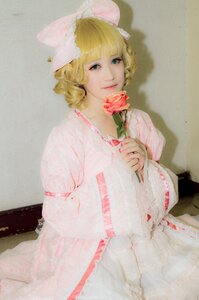 Rating: Safe Score: 0 Tags: 1girl blonde_hair blue_eyes dress flower hinaichigo holding holding_flower looking_at_viewer photo rose solo traditional_media wide_sleeves User: admin