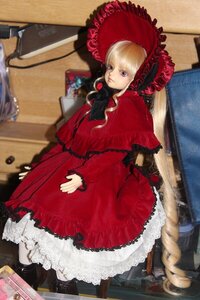 Rating: Safe Score: 0 Tags: 1girl blonde_hair blurry bonnet depth_of_field doll dress frills lace long_hair long_sleeves photo red_dress shinku solo suitcase User: admin