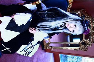 Rating: Safe Score: 0 Tags: 1girl dress frills gothic_lolita hairband lolita_fashion long_hair long_sleeves looking_at_viewer silver_hair sitting solo suigintou User: admin