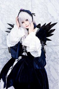 Rating: Safe Score: 0 Tags: 1girl 3d dress frills hairband long_hair long_sleeves looking_at_viewer red_eyes silver_hair solo suigintou wings User: admin