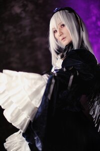 Rating: Safe Score: 0 Tags: 1girl blurry blurry_background depth_of_field dress flower long_hair long_sleeves red_eyes solo suigintou User: admin