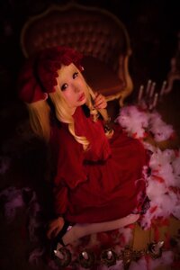 Rating: Safe Score: 0 Tags: 1girl blonde_hair bow dress drill_hair long_hair looking_at_viewer red_dress shinku shoes sitting solo twin_drills User: admin