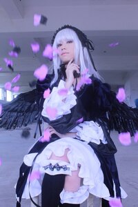 Rating: Safe Score: 0 Tags: 1girl bangs black_wings boots closed_mouth dress feathers flower frills gothic_lolita hairband lolita_fashion long_hair petals solo suigintou wings User: admin