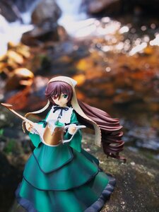 Rating: Safe Score: 0 Tags: 1girl black_neckwear blurry blurry_background brown_hair depth_of_field doll dress drill_hair frills green_dress green_eyes heterochromia long_hair long_sleeves looking_at_viewer outdoors red_eyes ribbon solo standing suiseiseki very_long_hair watering_can User: admin