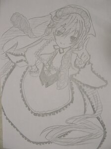 Rating: Safe Score: 0 Tags: 1girl dress frills greyscale image index_finger_raised long_hair looking_at_viewer monochrome monster_girl smile solo suiseiseki traditional_media wings User: admin
