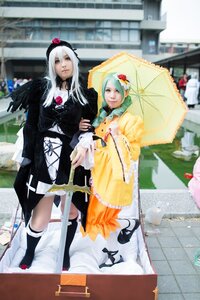 Rating: Safe Score: 0 Tags: 2girls blurry blurry_background blurry_foreground depth_of_field dress holding_umbrella long_hair multiple_cosplay multiple_girls parasol photo shared_umbrella tagme umbrella User: admin